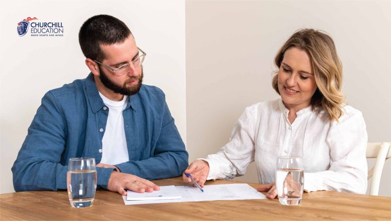 Man and woman looking at document