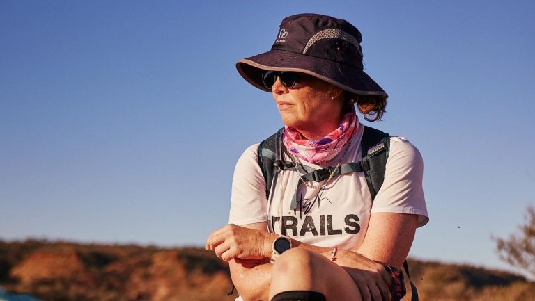 Tricia sitting in desert background