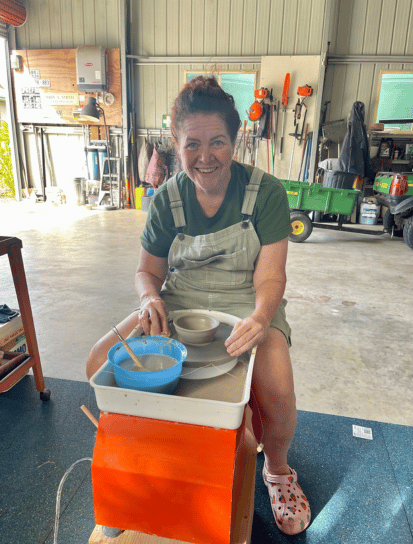 Woman at a pottery wheel