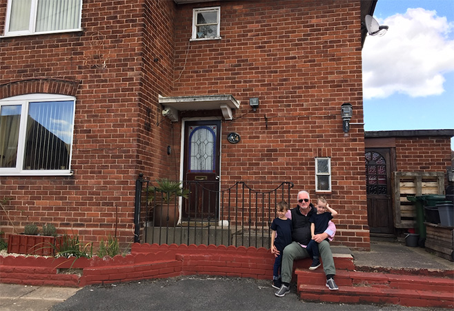 Paddy and his grandsons outside his childhood house in Chester, UK. 