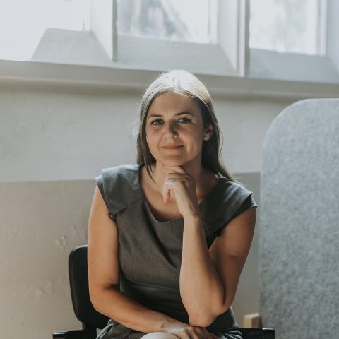 Corporate woman posing for portrait picture in office.