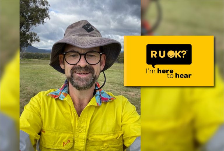 Man in high viz asking RUOK?