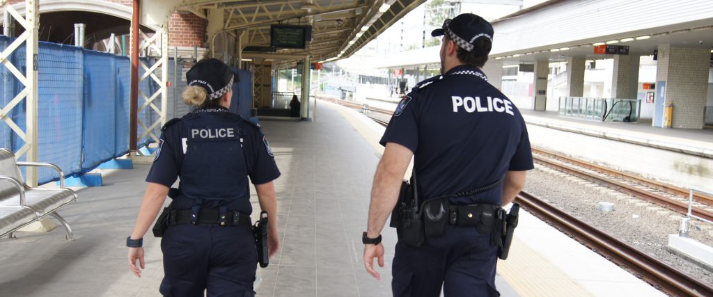 two police officers at train station