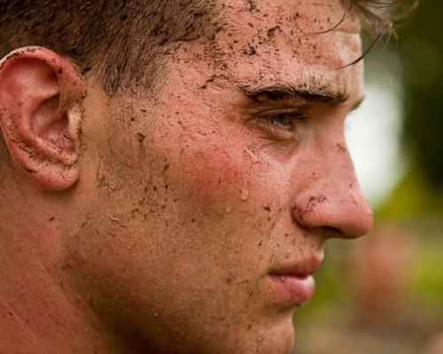 Man with mud on face